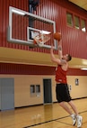 Senior Airman John Robertson, 741st Missile Security Forces Squadron convoy response force leader, performs a lay-up Oct. 17 at the Malmstrom Air Force Base fitness center. Robertson, 22, is one out of 22 Airmen selected to try out for the Air Force men’s basketball team. (U.S. Air Force photo/Airman 1st Class Joshua Smoot)
