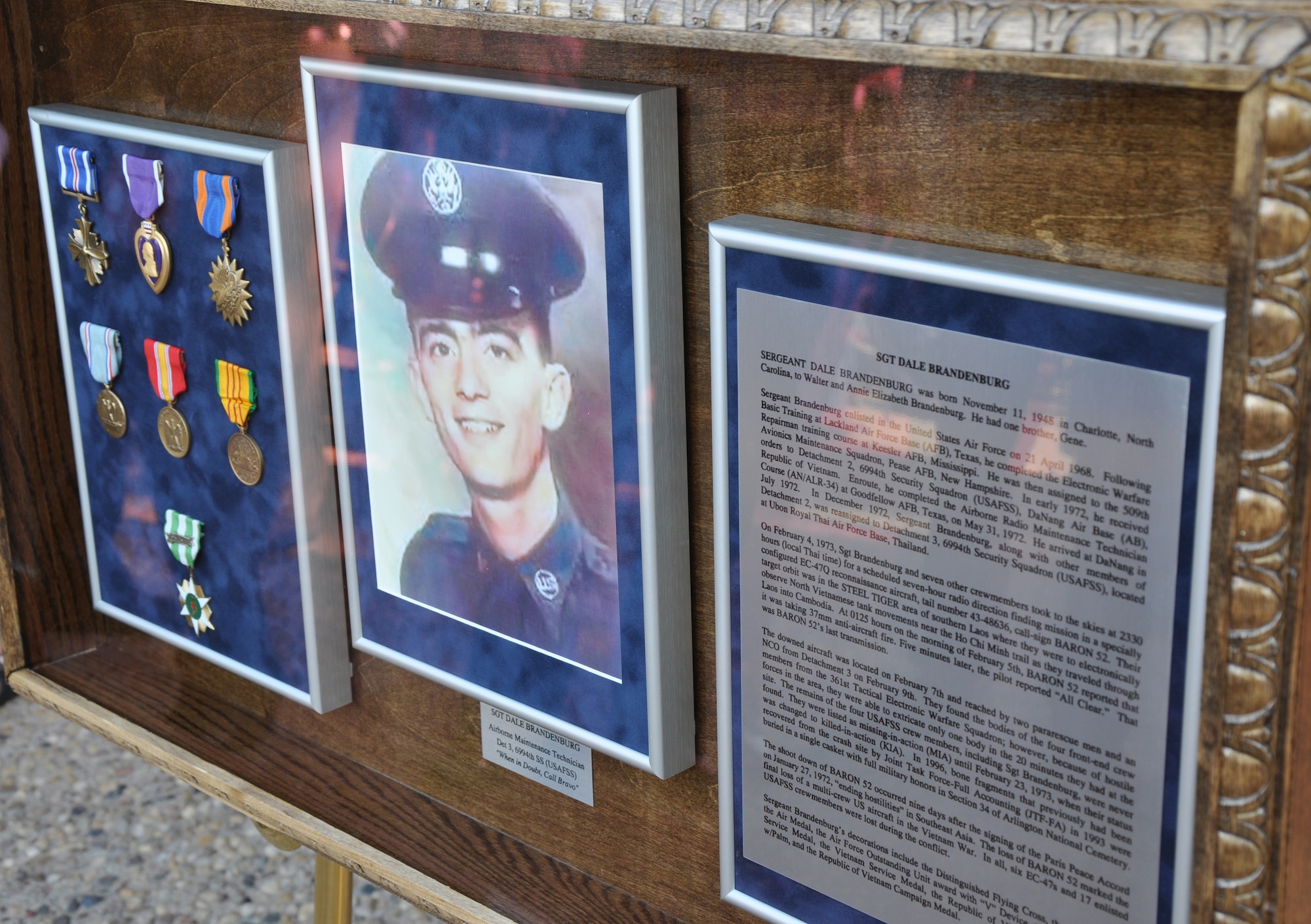GOODFELLOW AIR FORCE BASE, Texas – Vietnam War veteran Sgt. Dale Brandenburg’s shadow box sits on display after the Brandenburg Hall Memorialization at the 17th Training Group building Oct. 27. The shadow box is now displayed within the newly dedicated Brandenburg Hall. (U.S. Air Force photo/ Senior Airman Joshua Edwards)