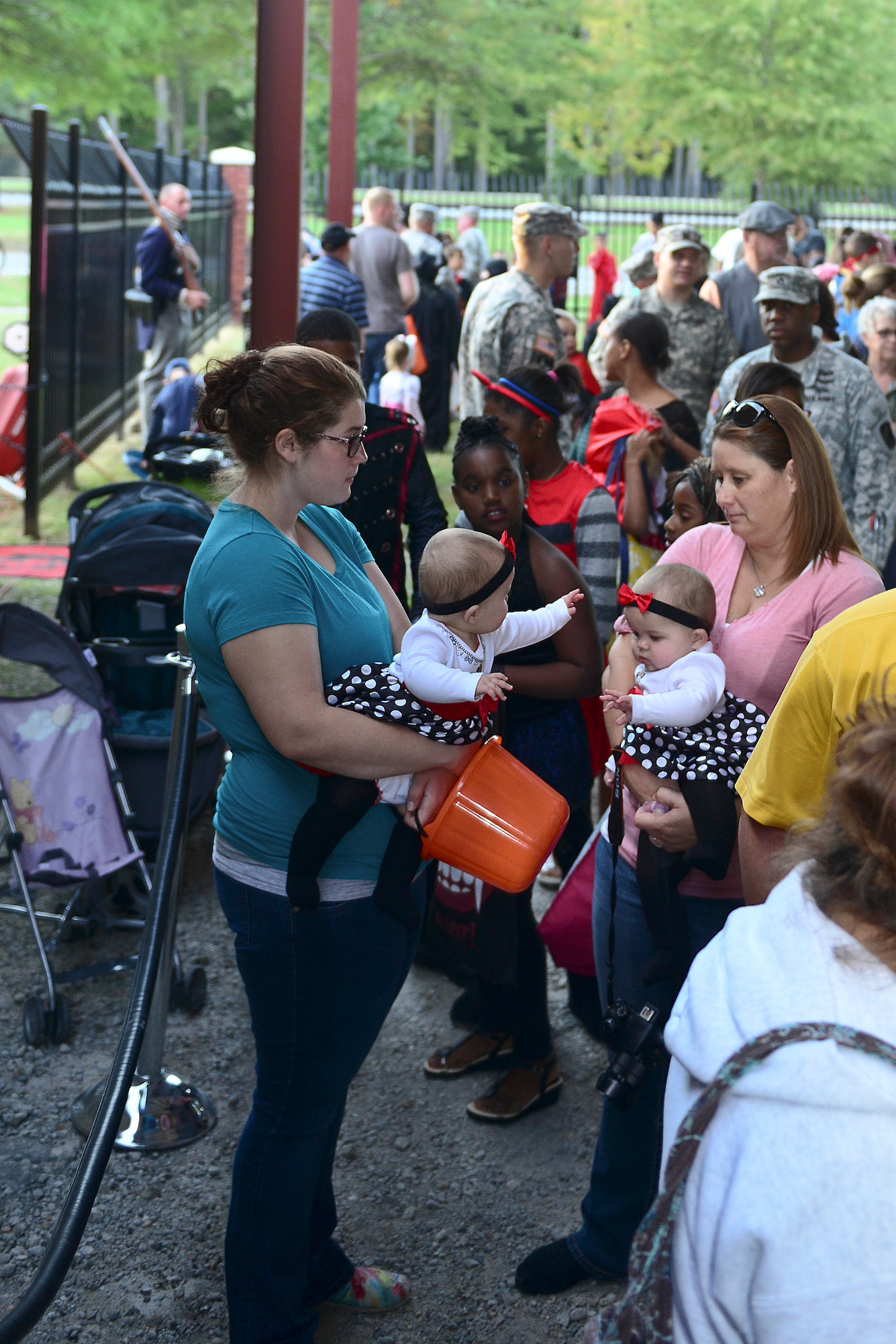 Fort Eustis community members stand in a line for the Night at the Transportation Museum event at Fort Eustis, Va., Oct. 27, 2014. Families walked the spooky museum while volunteers posed as mannequins in more than 10 different transportation-themed galleries. (U.S. Air Force photo by Airman 1st Class Kimberly Nagle/Released)