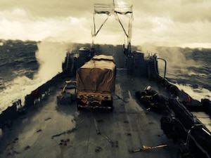 The Landing Craft Utility Runnymede braves seven-foot seas on its way to a training mission near Cape Henry, Va., Oct. 23, 2014. An LCU can land just about anywhere there is a beach, which makes it a valuable asset in quickly loading and unloading humanitarian aid after a disaster. (Courtesy photo)