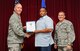 Wayne Wilson, 33rd Fighter Wing budget analyst, is presented the 33rd Fighter Wing civilian of the quarter category III award from Col. Todd Canterbury, 33rd FW commander, and Chief Master Sgt. Scott Berge, 33rd FW command chief, on Eglin Air Force Base, Fla., Oct 17, 2014. Wilson managed the limitation metric by balancing a $12.4 million budget across 10 Congress, Department of Defense and Air Force mandates, allowing the 33rd FW to fall in line with strategic goals. (U.S. Air Force photo/Staff Sgt. Marleah Robertson)