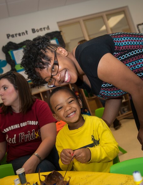 Trinique Smith and her son, William Anderson, smile for a photo during the Child Development Center’s Fantastic Fall event Oct. 24, 2014, at Moody Air Force Base, Ga. Not shown in the photo was Anderson’s father, U.S. Air Force Airman 1st Class Gary Smith, who is assigned to the 723d Aircraft Maintenance Squadron. (U.S. Air Force photo by Senior Airman Jarrod Grammel/Released)
