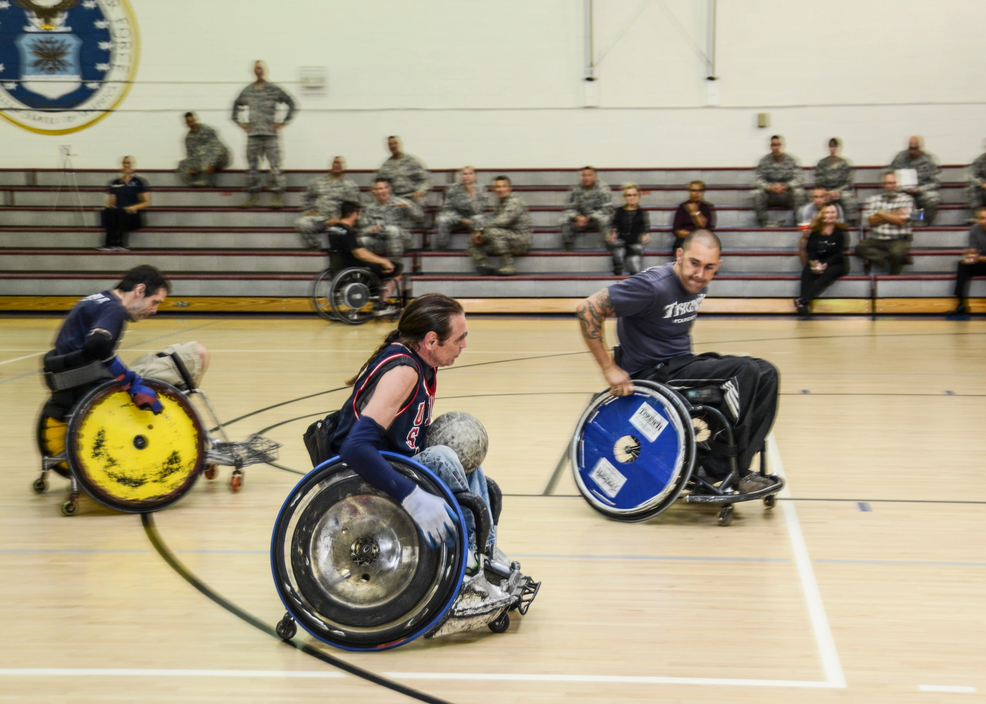 Triumph Foundation players go on a fast break during an exhibition wheelchair rugby game at the Rosburg Fitness Center Oct. 27. The foundation's mission is to help people who suffer spinal chord injuries restore their lives. (U.S. Air Force photo by Rebecca Amber)