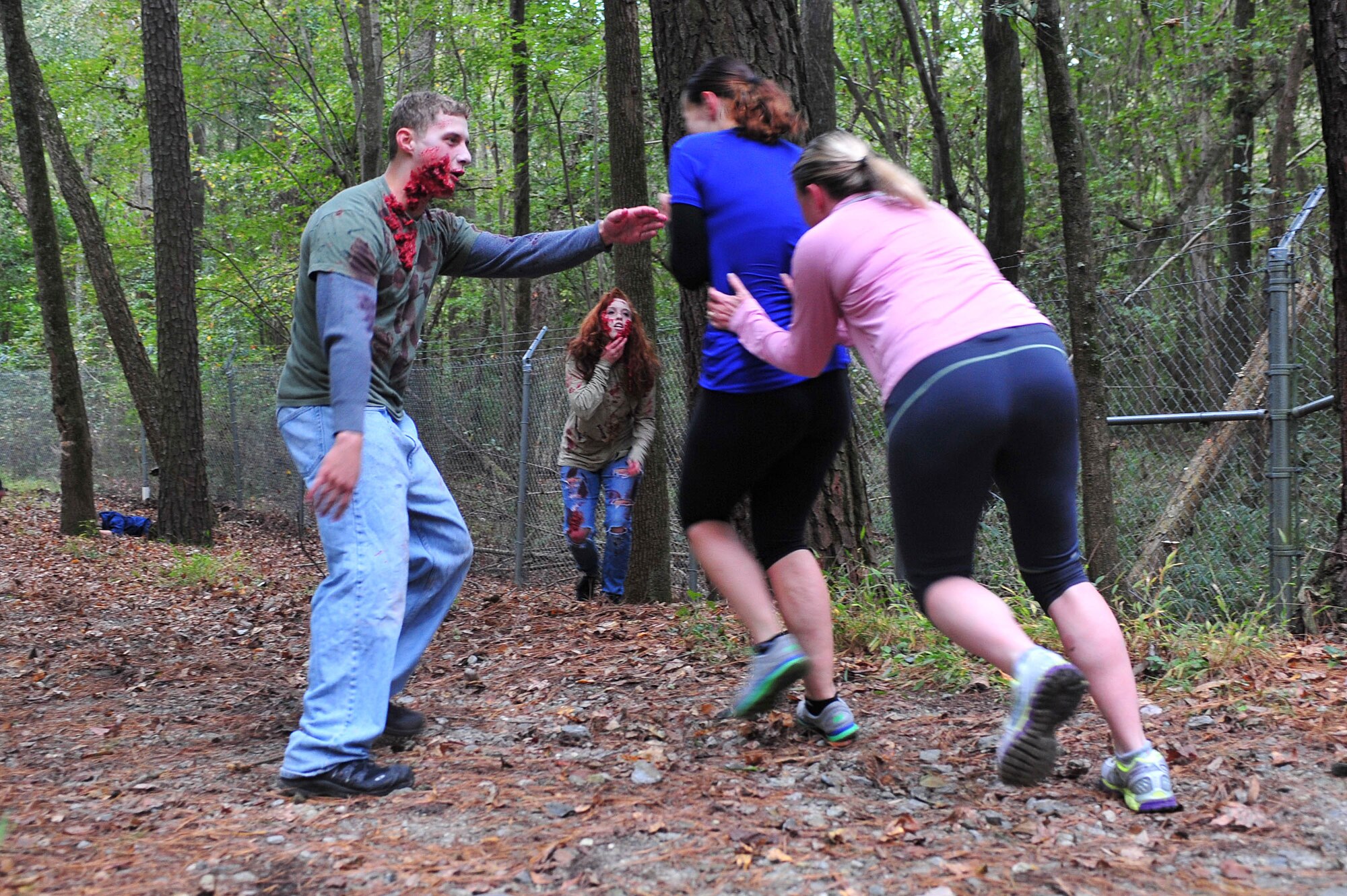Members of Team Seymour run for their lives during a Zombie 5K here Oct. 24. (U.S. Air Force photo/Senior Airman John Nieves Camacho)