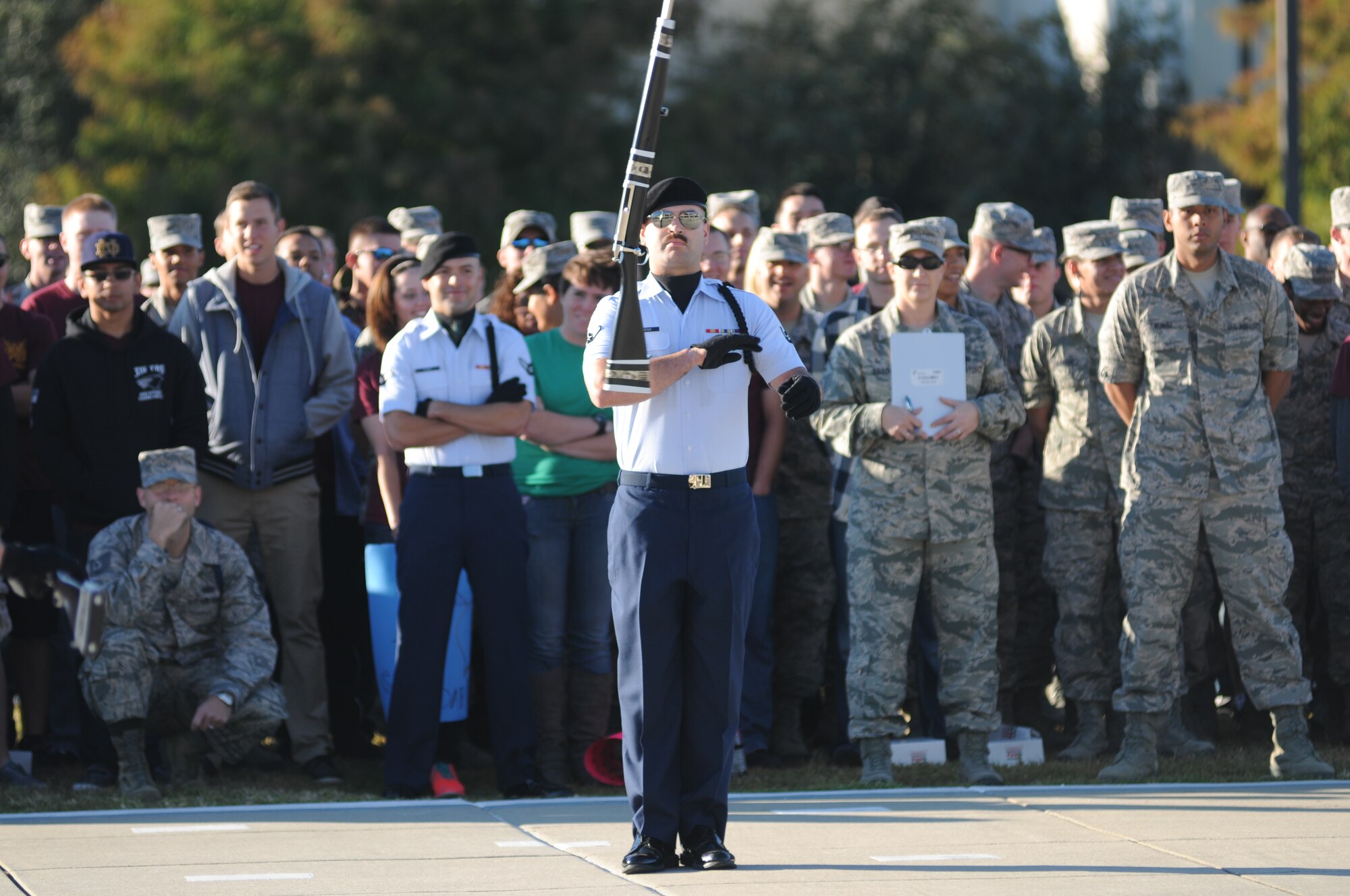 Airman Robert Levens, 334th Training Squadron freestyle drill master, spins his weapon during the freestyle portion of the 81st Training Group drill down Oct. 24, 2014, at the Levitow Training Support Facility Drill Pad, Keesler Air Force Base, Miss. The 334th TRS “Gators” placed third in the freestyle competition. (U.S. Air Force photo by Kemberly Groue)