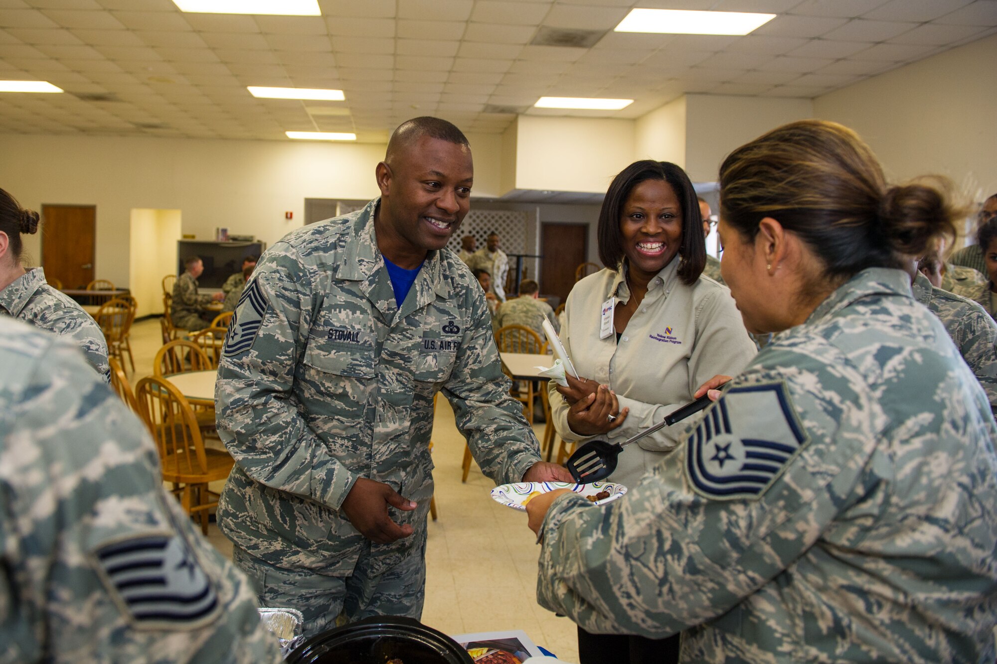 U.S. Airmen, assigned to the 169th Fighter Wing at McEntire Joint National Guard Base of the South Carolina Air National Guard, celebrate Diversity Day by eating a variety of ethnic foods and sharing cultural camaraderie, Oct. 4, 2014. Diversity Day combines the Department of Defense's monthly diversity programs into a one day event for guardsmen to learn about other cultures and to celebrate diversity. (U.S. Air National Guard by photo by Tech. Sgt. Jorge Intriago/Released) 
