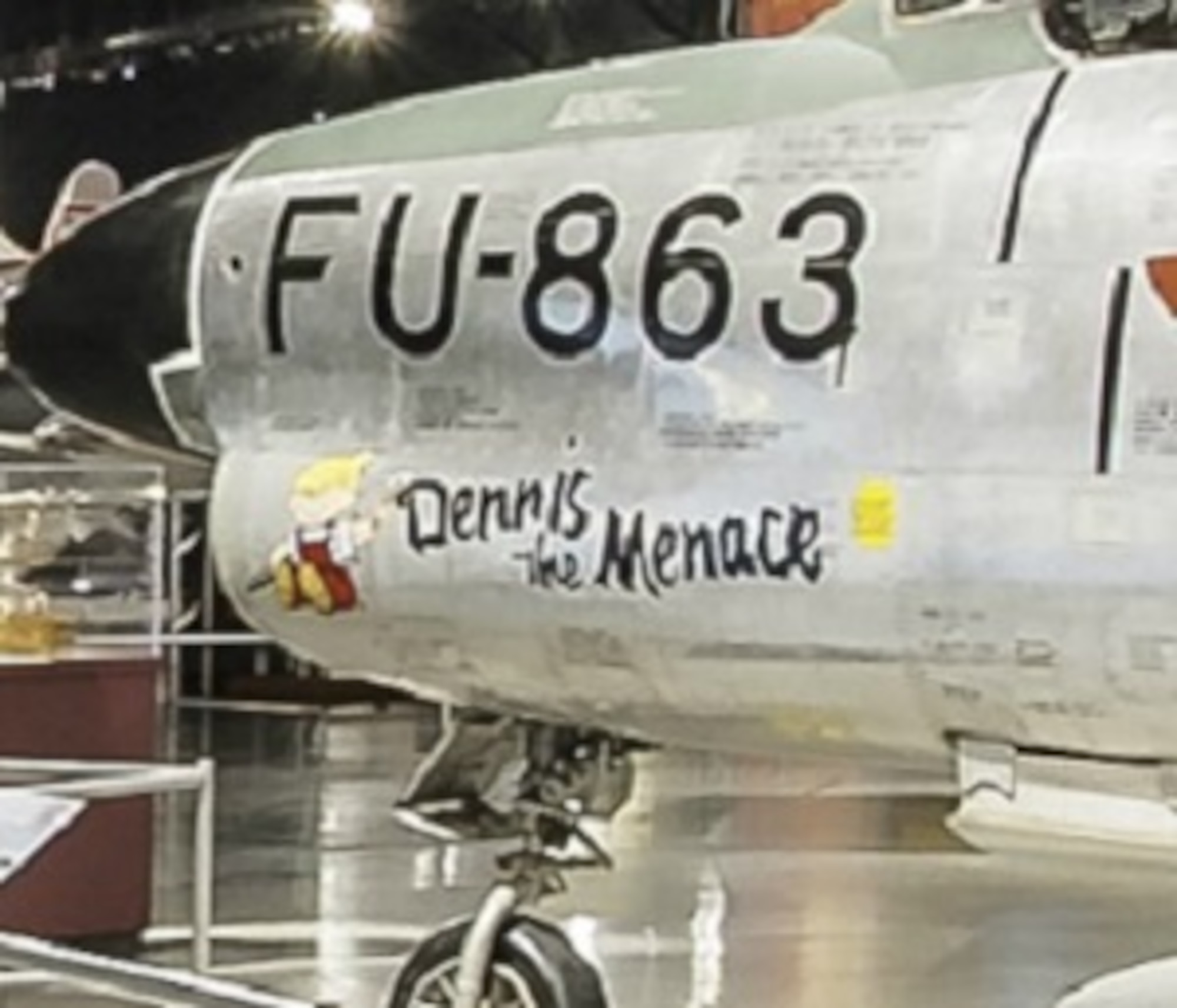 COLD WAR GALLERY - Under a plane with orange wings, find Dennis the Menace. (Screenshot from NMUSAF Virtual Tour)