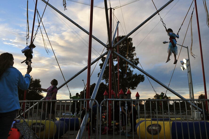 Team Seymour kids get a thrill on the carnival rides during the Halloween Block Party at Seymour Johnson Air Force Base, North Carolina, Oct. 24. (U.S. Air Force photo/Senior Airman John Nieves Camacho)
