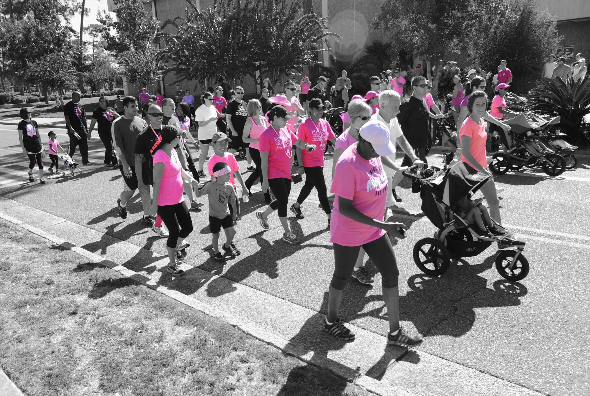 Keesler personnel participate in a Breast Cancer Awareness 5K Run/Walk Oct. 24, 2014, at Keesler Air Force Base, Miss.  The event raised funds for Breast Cancer Awareness Month which is recognized throughout October. (U.S. Air Force photo illustration by Kemberly Groue)