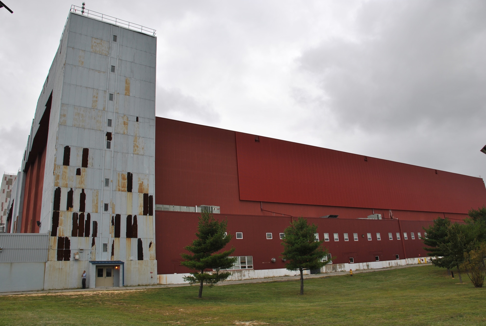 Two hangars at Joint Base McGuire-Dix-Lakehurst, New Jersey, are saving as much as $100,000 per year in utility costs following the installation of solar walls last year. The walls were specially designed to blend with the existing walls, a requirement because of the historic nature of the facilities. (U.S. Air Force photo)
