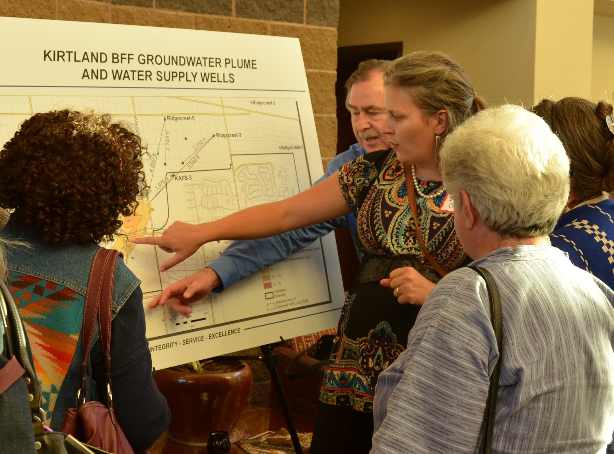 Contractors on the Kirtland Air Force Base plume project, explain how the Air Force plans to collapse the contamination area during a meeting Oct. 23 in Albuquerque, New Mexico, (U.S. Air Force photo/Armando Perez)