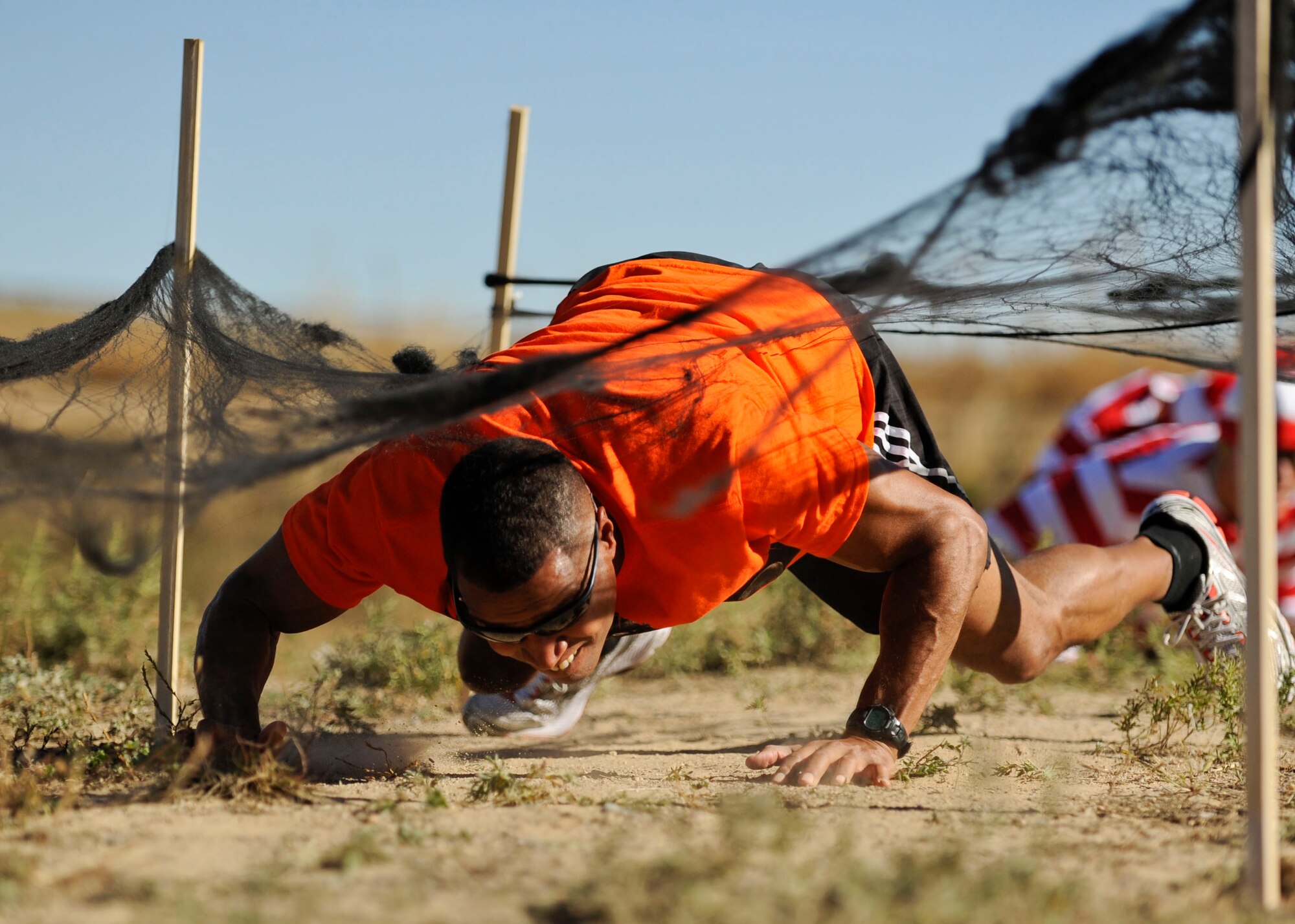 PETERSON AIR FORCE BASE, Colo. – Timothy Parker, 21st Wing Staff Agencies deputy director, crawls his way through an obstacle during the Spooky Warfit 5k Oct. 24. During the event those who dressed in costume not only ran a 5K but also completed several obstacles that lined the course. (U.S. Air Force photo/Airman 1st Class Rose Gudex)
