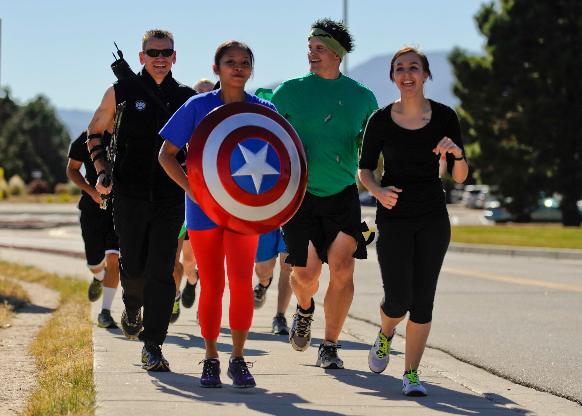 PETERSON AIR FORCE BASE, Colo. – The Avengers from the 21st Mission Support Group run down the sidewalk to their first obstacle during Spooky Warfit Oct. 24. During the event those who dressed in costume not only ran a 5K but also completed several obstacles that lined the course. (U.S. Air Force photo/Airman 1st Class Rose Gudex)
