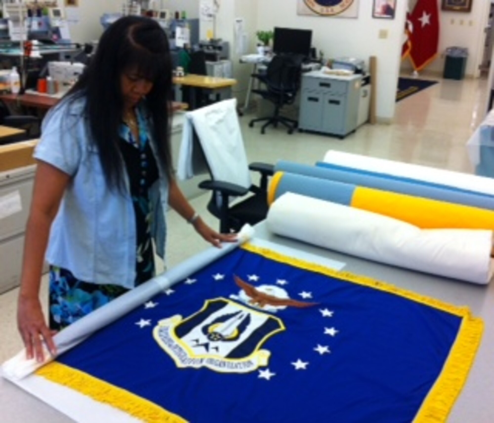 The flag is carefully packed before being shipped to HQ RIO. (Courtesy Photo)