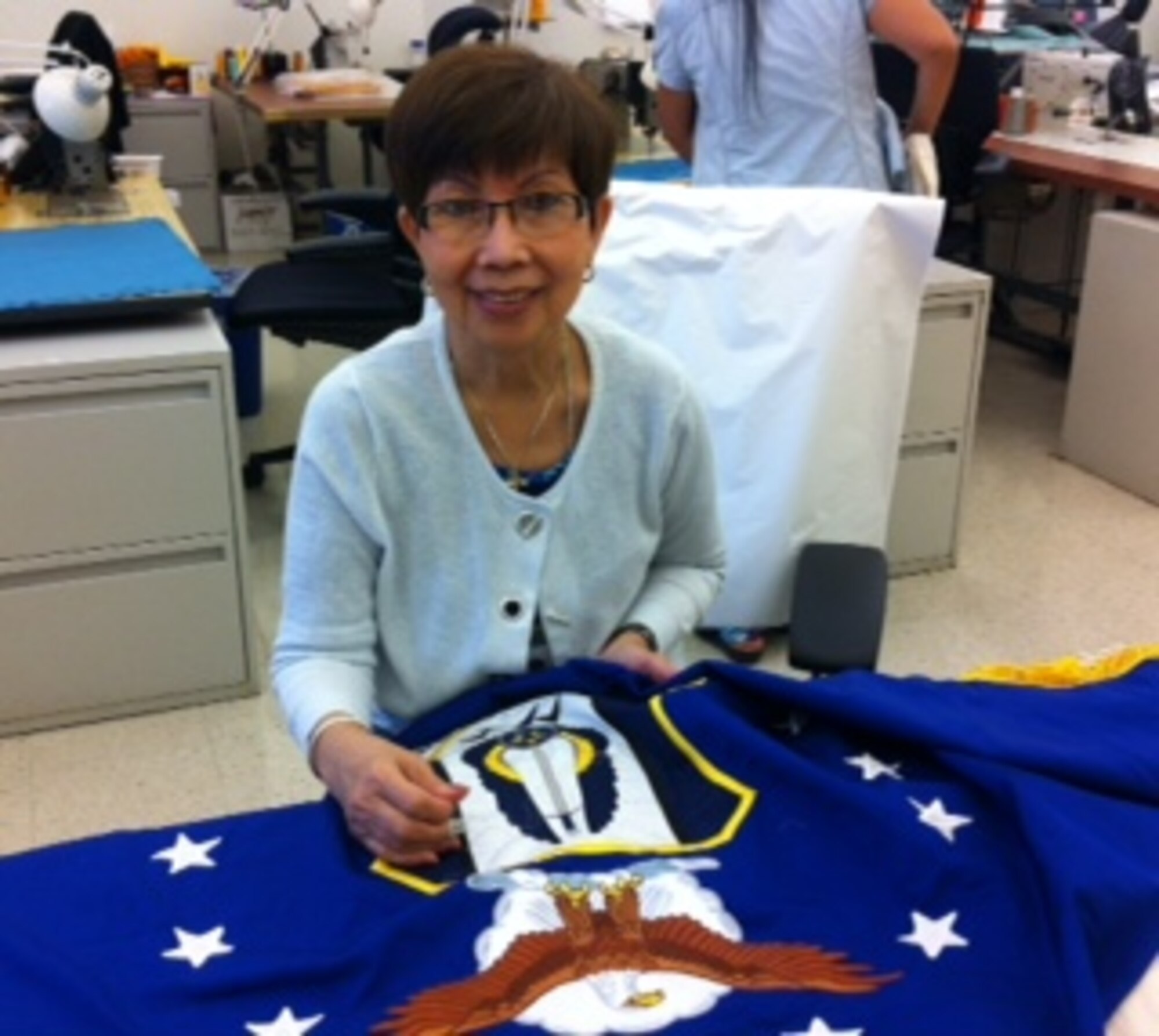 After a final inspection the embroidery is touched up by hand. (Courtesy Photo)