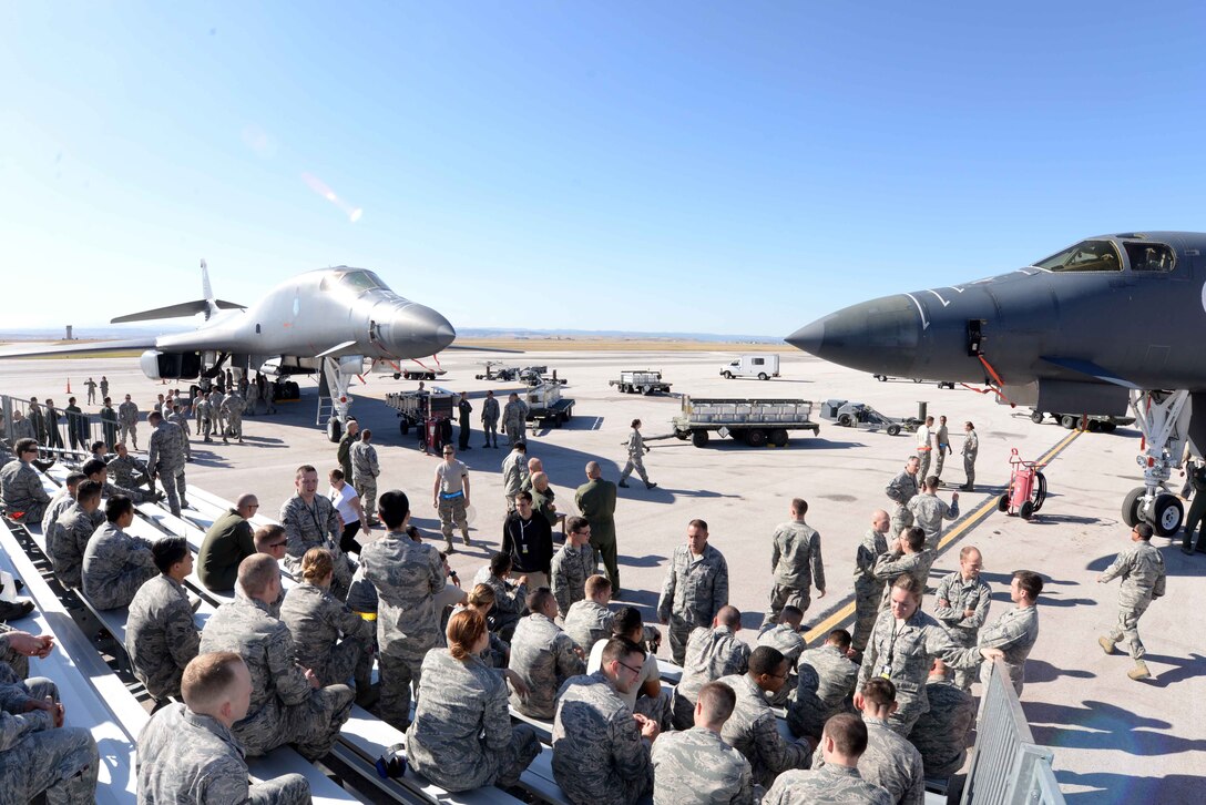 Load crew members and attendees of the 2014 Load Crew Competition gather for the announcement of the winner at Ellsworth Air Force Base, S.D. Oct. 20, 2014. Airmen from across Ellsworth gathered to support the competition of which the 34th AMU load crew won. (U.S. Air Force photo by Airman 1st Class Rebecca Imwalle/Released)