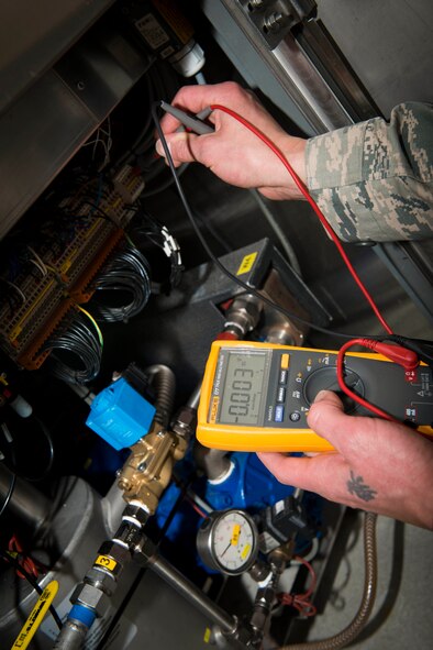Tech. Sgt. Doug Suazo, 5th Medical Support Squadron biomedical equipment technician, checks voltage levels on an instrument sterilizer on Minot Air Force Base, N.D., Oct. 22, 2014. As the only biomedical equipment technician currently on base, it is Suazo’s job to ensure all biomedical equipment in the hospital is functioning correctly. (U.S. Air Force photo/Airman 1st Class Sahara L. Fales)