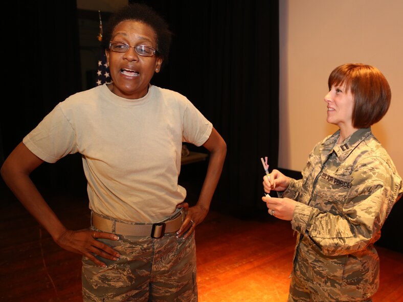 The commander of the 932nd Medical Group, Col. Vanessa Mattox, prepares to receive her flu shot during the commander's call.  Reservists are reminded to get their required shot as soon as possible if they were gone during the special briefing.   (U.S. Air Force photo/Staff Sgt. Amber Hodges)