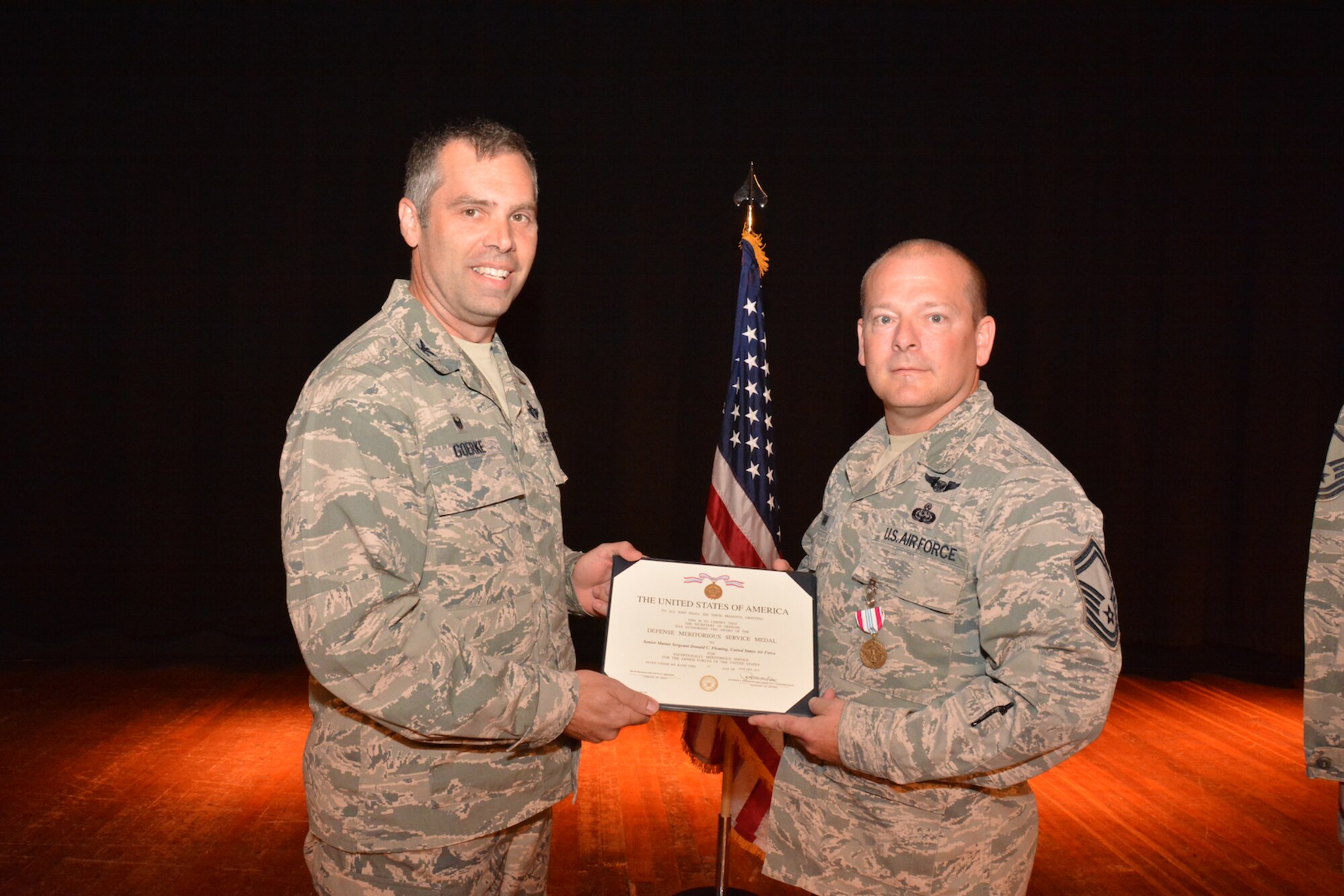 Another proud moment in the unit's history happened over the unit training assembly weekend as Col. Karl Goerke, commander of the 932nd Airlift Wing, presented the Defense Service Medal to Senior Master Sgt. Donald Fleming for outstanding achievement during his work in Afghanistan and Operation Enduring Freedom. (U.S. Air Force photo/Staff Sgt. Amber Hodges)