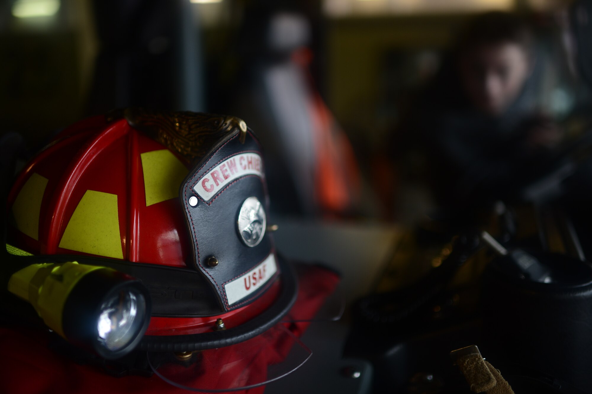 A firefighter’s safety helmet rests inside a fire truck at Spangdahlem Air Base, Germany, Oct. 27, 2014. The tour included a look at the base’s passenger terminal, a fire station and ended with photo opportunities at the air park. (U.S. Air Force photo by Senior Airman Gustavo Castillo/Released)