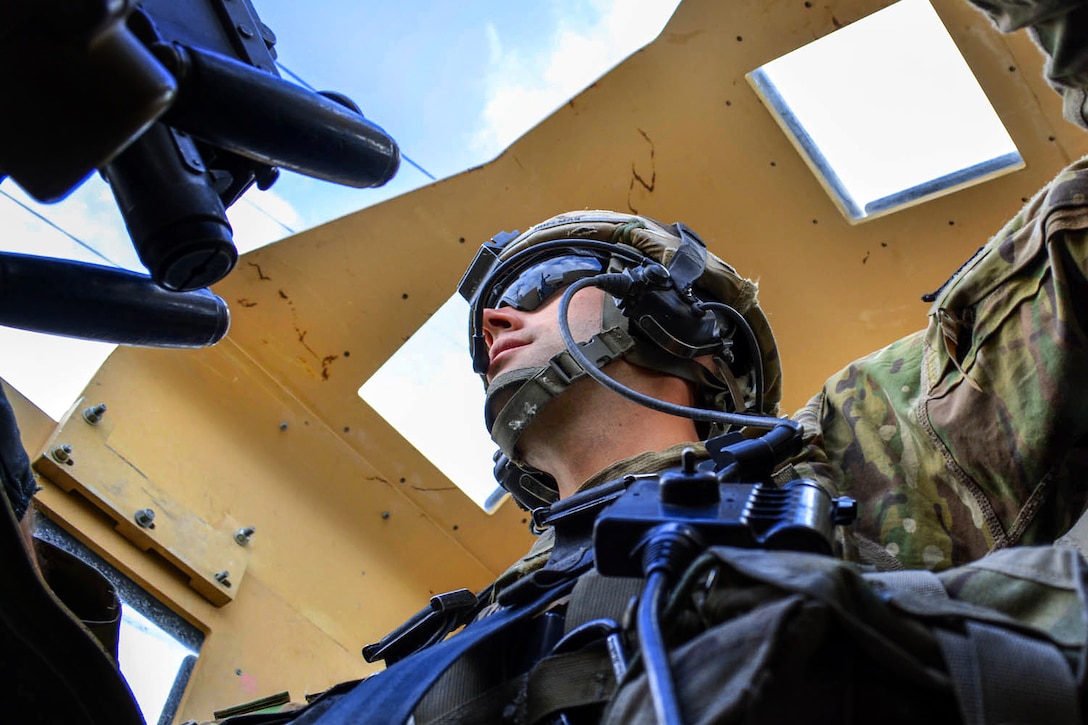 U.S. Army Sgt. Scott Hoffman mans the turret gun on his tactical vehicle during a mounted reconnaissance patrol in eastern Afghanistan, Oct. 13, 2014. Hoffman is a cavalry scout assigned to the 101st Airborne Division's 1st Squadron, 75th Cavalry Regiment. 