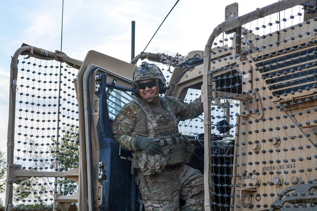 U.S. Army Spc. Jose Martinez dismounts his mine-resistant, ambush-protected vehicle for a patrol in a village in eastern Afghanistan, Oct. 13, 2014. Martinez is a cavalry scout assigned to the 101st Airborne Division's 1st Squadron, 75th Cavalry Regiment.