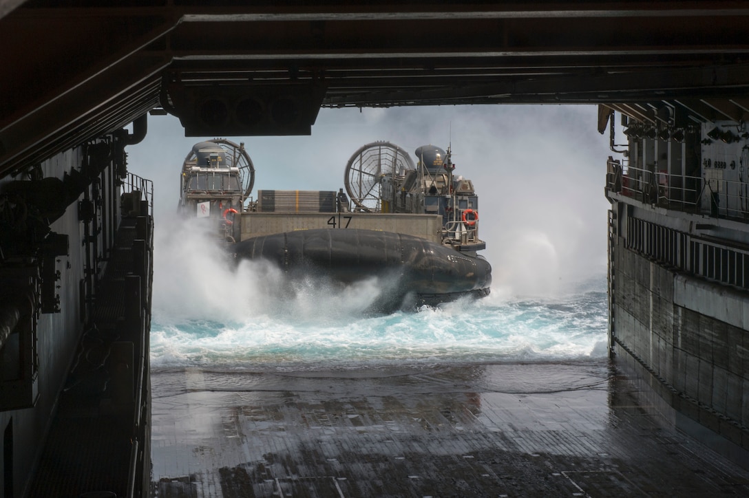 Landing Craft Air Cushion (LCAC) 47, assigned to Naval Beach Unit (NBU) 7, embarks the well deck of the amphibious dock landing ship USS Germantown (LSD 42) during Amphibious Landing Exercise 2015 (PHIBLEX15). PHIBLEX15 is an annual bilateral training exercise conducted with the Armed Forces of the Philippines. Germantown is part of the Peleliu Expeditionary Strike Group, commanded by Rear Adm. Hugh Wetherald, and is conducting joint forces exercises in the U.S. 7th Fleet area of responsibility.  (U.S. Navy Photo by Mass Communication Specialist 2nd Class Amanda R. Gray/Released)