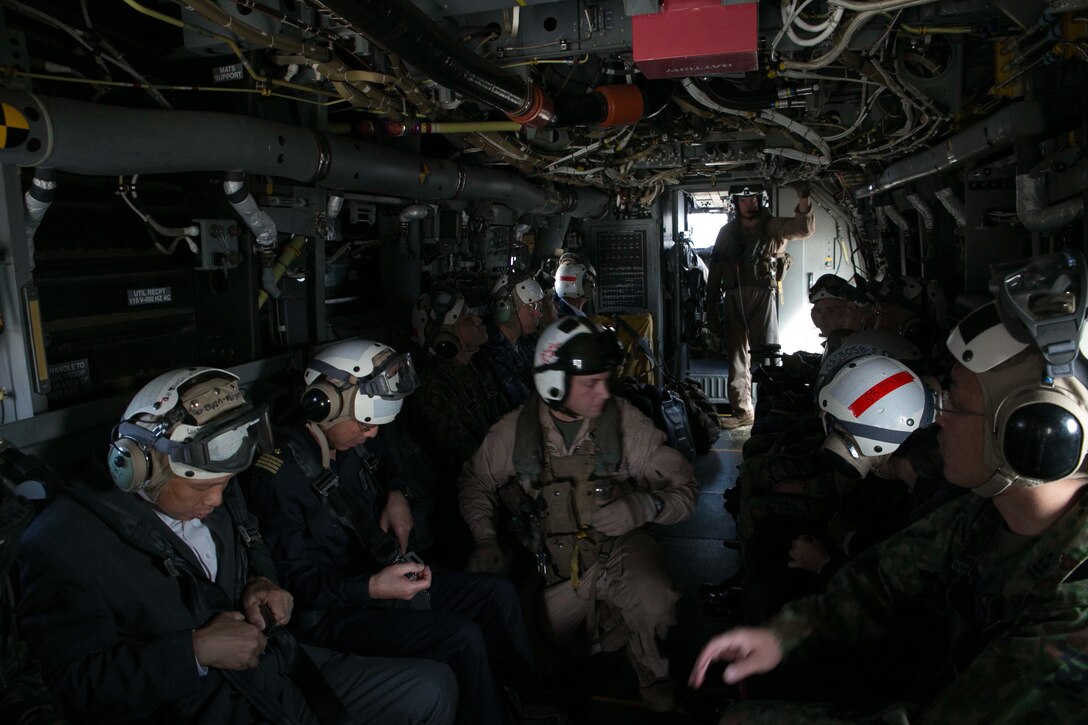 Japanese officials and Marines with Marine Medium Tiltrotor Squadron 265 prepare for take-off during a familiarization flight on the MV-22 Osprey Oct. 25 at Fleet Activities Yokosuka, Japan. Before the flight, Marines answered questions about the Osprey’s specifications; such as its load capacity and how much faster, farther, and higher it can fly than the CH-46E Sea Knight, the helicopter it replaced. The Marines and Osprey are with Marine Aircraft Group 36, 1st Marine Aircraft Wing, III Marine Expeditionary Force. 