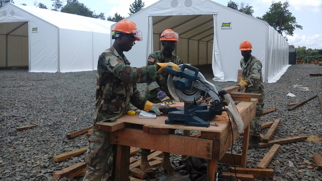 Supporting Operation United Assistance, Armed Forces of Liberia engineers work on the Tubmanburg Ebola treatment unit. Crews quickly put up a series of tents on freshly leveled and graveled ground. The U.S. Agency for International Development is the lead U.S. Government organization for Operation United Assistance. U.S. Africa Command is supporting the effort by providing command and control, logistics, training and engineering assets to contain the Ebola virus outbreak in West African nations.