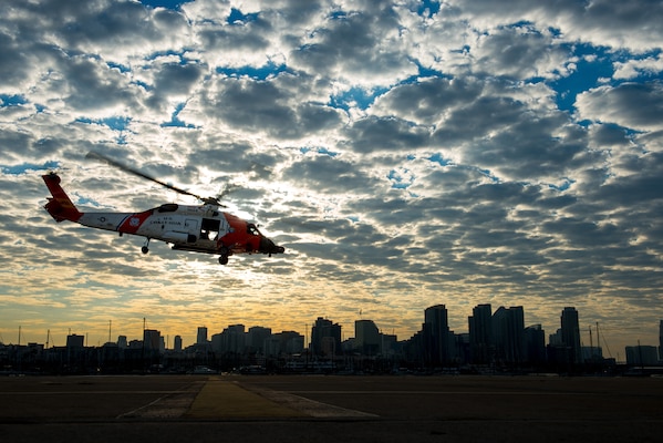 A Coast Guard helicopter from CG Sector San Diego, takes off carrying Marine Corps Sgt. Maj. Bryan B. Battaglia, senior enlisted advisor to the chairman of the Joint Chiefs of Staff, and California Army National Guard Command Sgt. Maj. William Clark Jr., state senior enlisted advisor to the Adjutant General, in San Diego, Oct. 25, 2014. The two senior enlisted leaders received an aerial tour of their area of responsibility, along with a mission brief on the final day of their seven-day tour of military bases and facilities in Calif. 