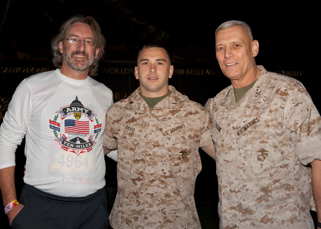The Assistant Commandant of the Marine Corps, Gen. John M. Paxton, Jr., presides over a promotion ceremony for 1st Lt. Davis at the Marine Corps War Memorial, Arlington, Va., Oct. 26, 2014. (U.S. Marine Corps photo by Cpl. Tia Dufour/Released)