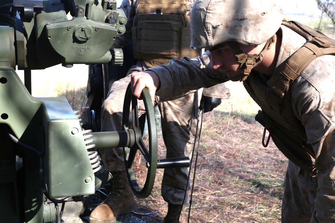Lance Cpl. Trevian Mortorff, a field artilleryman with 3rd Battalion, 14th Marine Regiment, 4th Marine Division, rotates the degree of fire on an M777A2 Lightweight Howitzer before firing rounds down range at Fort Indiantown Gap, Pa.,  during exercise Twisted Sister, a battalion fire exercise, Oct. 25, 2014. The M777A2 is an indirect field artillery cannon designed to be easily maneuverable for effective support maneuver warfare tactics. (Marine Corps Photo by Cpl. J. Gage Karwick/Released)