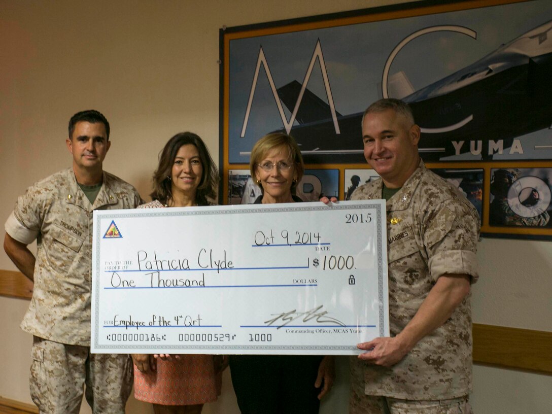Patricia Clyde, an animal control officer with the Provost Marshal’s Office aboard Marine Corps Air Station Yuma, Ariz., was selected as the MCAS Yuma Employee of the 4th Quarter. Col. Ricardo Martinez, MCAS Yuma Commanding Officer, presented her with a certificate Thursday in recognition for her services to the station.