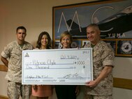 Patricia Clyde, an animal control officer with the Provost Marshal’s Office aboard Marine Corps Air Station Yuma, Ariz., was selected as the MCAS Yuma Employee of the 4th Quarter. Col. Ricardo Martinez, MCAS Yuma Commanding Officer, presented her with a certificate Thursday in recognition for her services to the station.