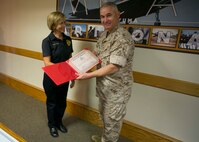 Patricia Clyde, an animal control officer with the Provost Marshal’s Office aboard Marine Corps Air Station Yuma, Ariz., was selected as the MCAS Yuma Employee of the 4th Quarter. Col. Ricardo Martinez, MCAS Yuma Commanding Officer, presented her with a certificate Thursday in recognition for her services to the station.