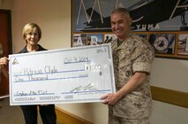 Patricia Clyde, an animal control officer with the Provost Marshal’s Office aboard Marine Corps Air Station Yuma, Ariz., was selected as the MCAS Yuma Employee of the 4th Quarter. Col. Ricardo Martinez, MCAS Yuma Commanding Officer, presented her with a certificate Thursday in recognition for her services to the station.