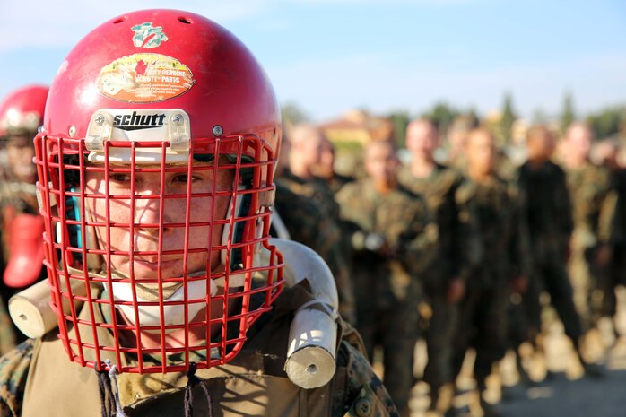 Recruit Samuel Aguilar, Platoon 1074, Delta Company, 1st Recruit Training Battalion, waits for his turn at a pugil sticks match at Marine Corps Recruit Depot San Diego, Oct. 21. This was the third and final pugil sticks exercise for the recruits of Company D.