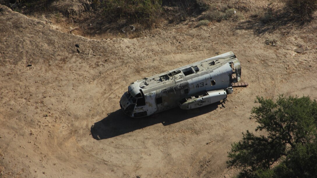 Marines with 3rd Marine Air Wing, I Marine Expeditionary Force, used the remains of a CH-46E Sea Knight to represent a crashed UH-1Y Huey during a mishap drill at Marine Corps Base Camp Pendleton, Calif., Oct. 27, 2014. The drill provided first responders the opportunity to practice every step of responding to a disabled aircraft including coordinating military and civilian agencies and rescuing the crew of the aircraft. 