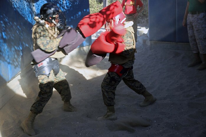 Recruits of Delta Company, 1st Recruit Training Battalion, fight each other during a pugil sticks match at Marine Corps Recruit Depot San Diego, Oct. 21. To win, a recruit must land a strike to the head or land more strikes to the body than his opponent.