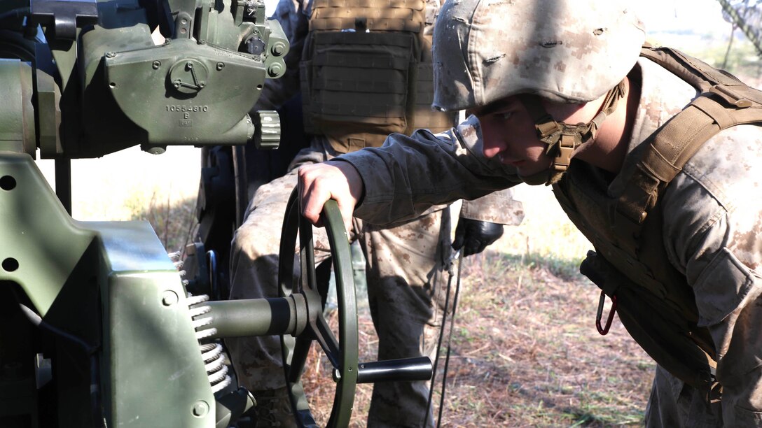 Lance Cpl. Trevian Mortorff, a field artilleryman with 3rd Battalion, 14th Marine Regiment, 4th Marine Division, rotates the degree of fire on an M777A2 Lightweight Howitzer before firing rounds down range at Fort Indiantown Gap, Pa.,  during exercise Twisted Sister, a battalion fire exercise, Oct. 25, 2014. The M777A2 is an indirect field artillery cannon designed to be easily maneuverable for effective support maneuver warfare tactics. 