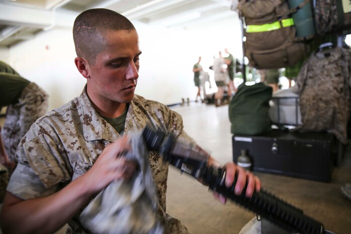 Recruit Kyle W. Bagley, Platoon 2109, Echo Company, 2nd Recruit Training Battalion, cleans his M-16A4 Service Rifle in his squad bay at Marine Corps Recruit Depot San Diego, Calif., Oct. 10. Bagley is a Camby, Ore., native and was recruited out of Recruiting Substation Camby, Ore.  When he was a sophomore in high school, he had a near death experience when he was involved in a major automobile accident.