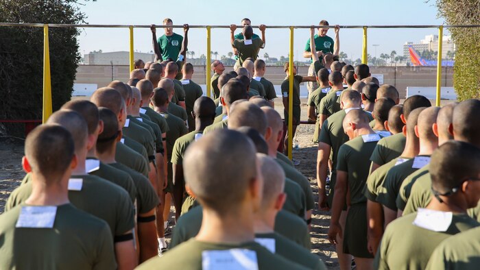Recruits of India Company, 3rd Recruit Training Battalion, perform pull-ups during their final Physical Fitness Test aboard Marine Corps Recruit Depot San Diego, Oct. 23.  To achieve a perfect score, recruits were required to perform 20 dead hang pull-ups.
