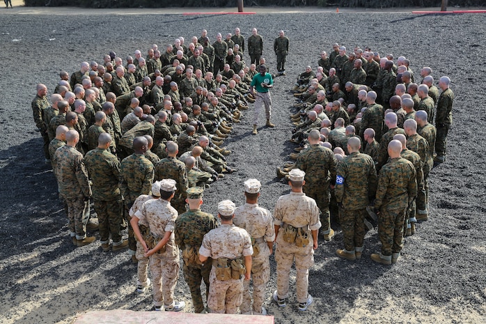Staff Sgt. Brandon J. Curry, drill instructor, Support Battalion, teaches recruit of Kilo Company, 3rd Recruit Training Battalion, basic techniques during the Intro to the Marine Corps Martial Arts Program class aboard Marine Corps Recruit Depot San Diego, Oct. 22.  Recruits formed up in what is referred to as the “classroom,” where they circle around the martial arts instructor so they can all see and hear the brief.