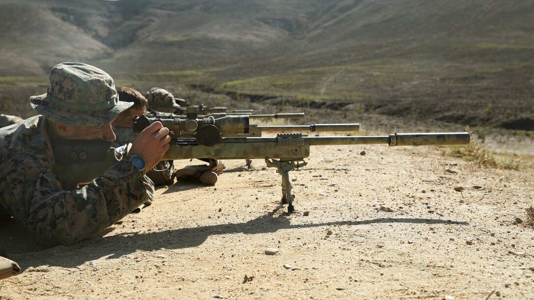 A Marine with 1st Marine Division Schools, pre-scout sniper course snaps in before engaging his target.  Division schools recently began the second week of training for Marines attending the pre-scout sniper course aboard Camp Pendleton California, Oct. 27 2014.
