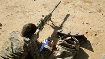 A Marine plots data after engaging a target during the pre-scout sniper course Oct. 27, 2014.  1st Marine Division schools recently began the second week of training for Marines attending the pre-scout sniper course aboard Camp Pendleton California.