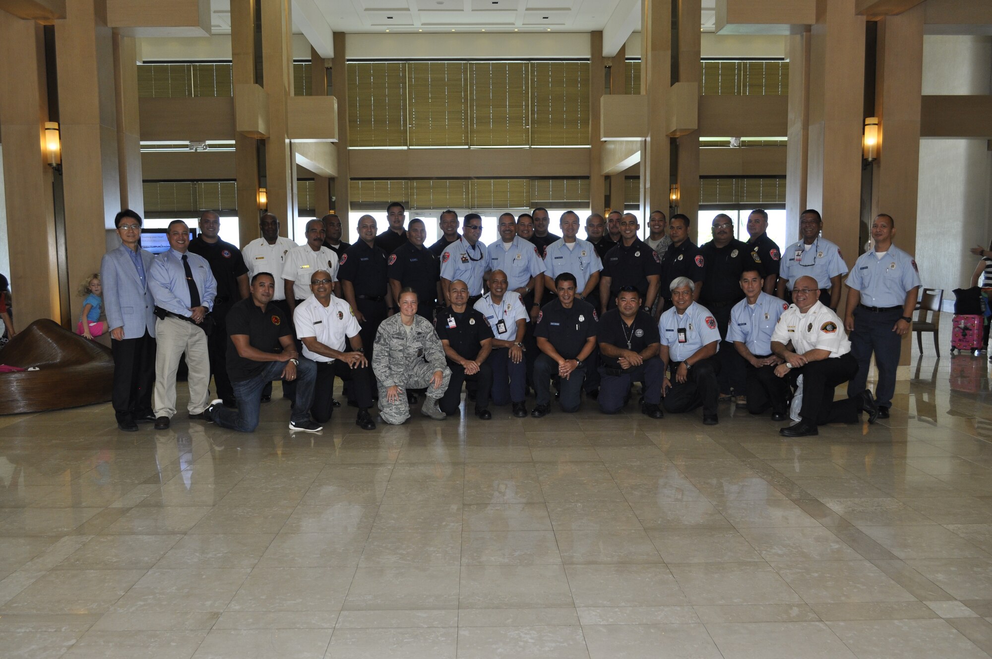 Chief Master Sgt. Joey Manibusan, standing second from left, an operations chief with the 44th Aerial Port Squadron, 624th Regional Support Group, Andersen Air Force Base, Guam, poses for a photo with a group of trainees at the Lotte Hotel, Tamuning, Guam, Oct. 25, 2014. Manibusan, a traditional reservist, is the senior fire marshal for the island of Guam in his civilian job. In coordination with the Western Pacific Islands Association of Fire Chiefs, he taught a “Fire Cause Determinations” course to 30 participants from Guam, Saipan, Palau, and the U.S. Navy and U.S. Air Force fire departments as part of the National Fire Academy curriculum, a first for the Pacific region. (Courtesy photo/Marianas Variety Guam Edition) 