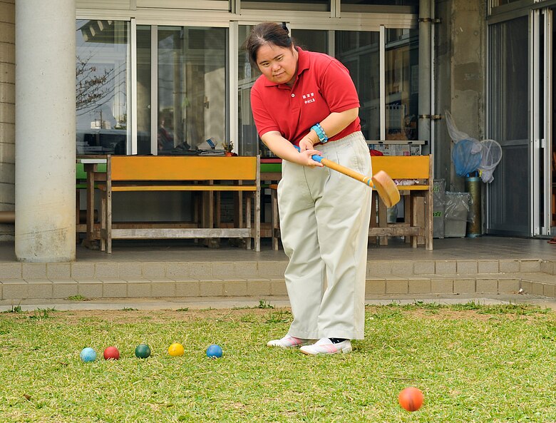 Yoshie Nakamura, welfare employment center employee, practices ground golf for her fourth Kadena Special Olympics at the Fuyo-Kan, welfare employment center, Oct. 28, 2014. Approximately 50 people will be participating in KSO from Fuyo-Kan, welfare employment center. (U.S. Air Force photo by Naoto Anazawa/Released)