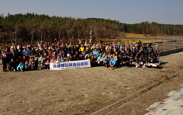 More than 200 members from Misawa Air Base and the local Japanese community came together to plant approximately 1,400 Japanese Black Pine trees for the 3rd Annual Coastal Shore Belt Reconstruction Forest Project near Itsukawame, Japan, Oct. 25, 2014. The local community plants seedlings every year along the coast to replace the ones destroyed in the 2011 tsunami in hope to restore the forest by 2020. (U.S. Air Force photo/Tech. Sgt. April Quintanilla) 

