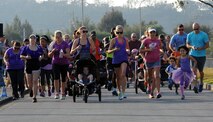 Participants in Kadena Family Advocacy's "Take a Stand Against Domestic Violence" 5K cross the starting line on U.S. Marine Corps Camp Lester, Japan, Oct. 25, 2014. The 5K was held in support of Domestic Violence Awareness Month, which has been observed each October since 1989. (U.S. Air Force photo by Airman 1st Class Zade C. Vadnais/Released)