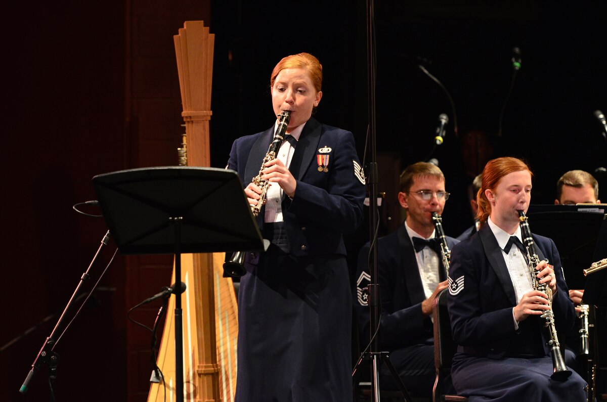 Technical Sergeant Sara Wollmacher takes center stage during a performance at Troy University in Troy, Alabama.  The performance was a part of the Concert Band and Singing Sergeants' Fall Tour 2014 which took them through parts of Alabama, Florida, and Georgia.  (U.S. Air Force Photo by Senior Master Sgt Bob Kamholz/released)